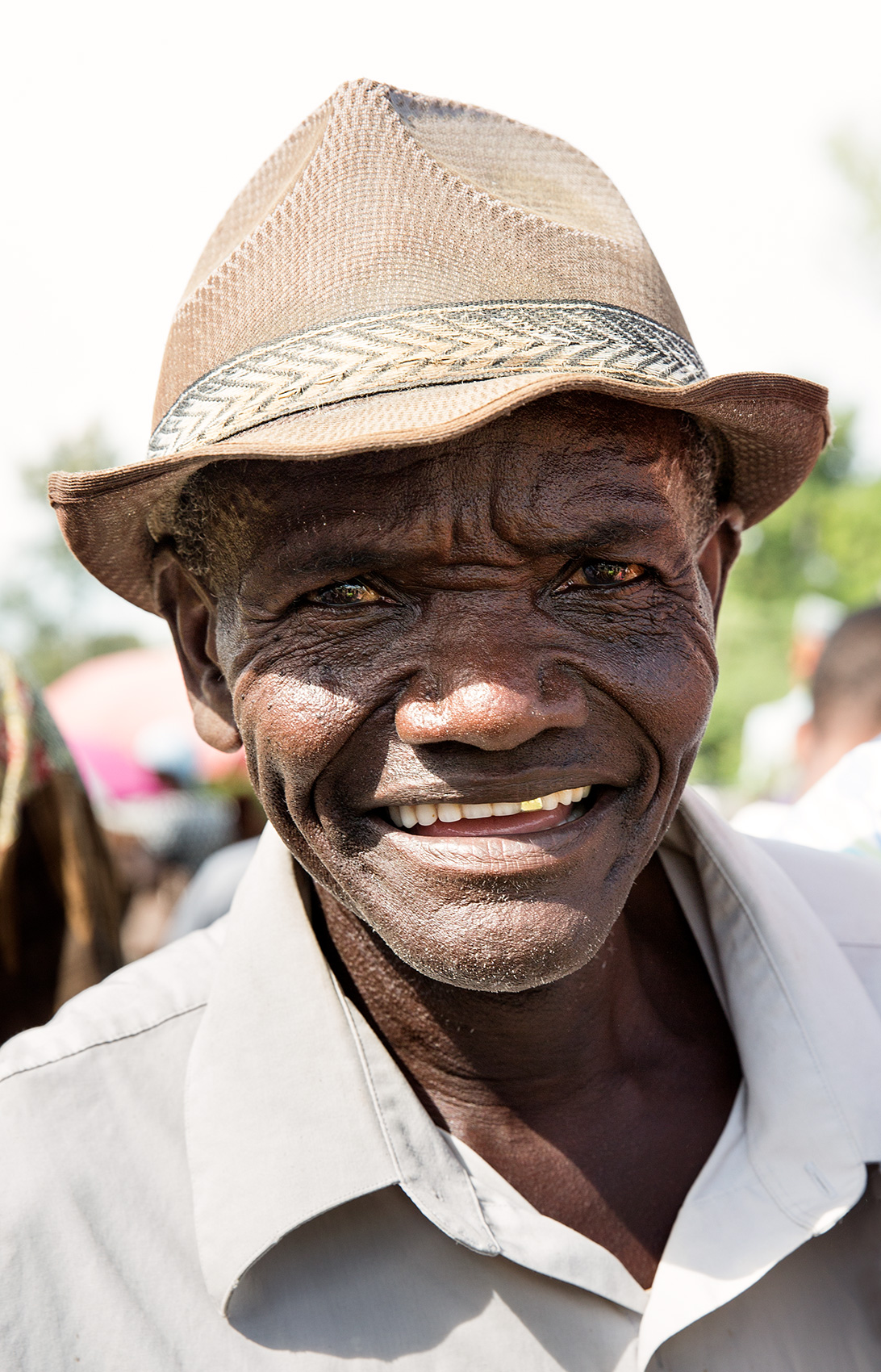 TRAVEL_HAITI_haitian_caribbean_market_hat_smile_0506_WB